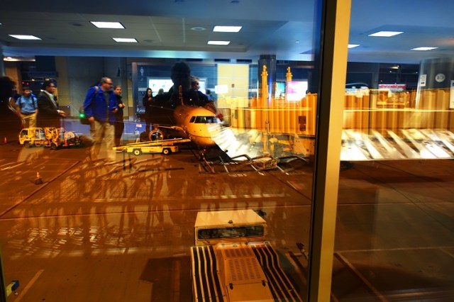 Reflections, baggage claim, plane, baggage carts