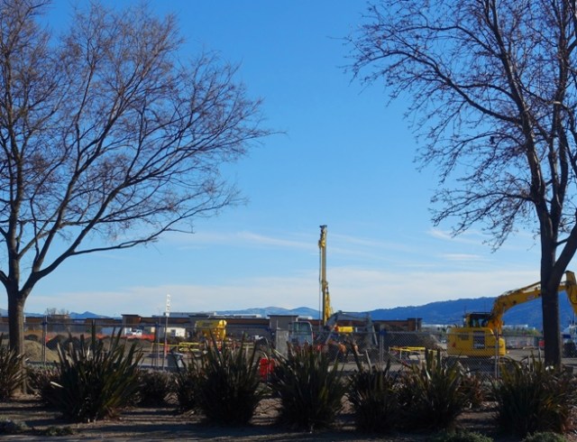 Construction Site, Pile Driver, Trees Budding, Spring