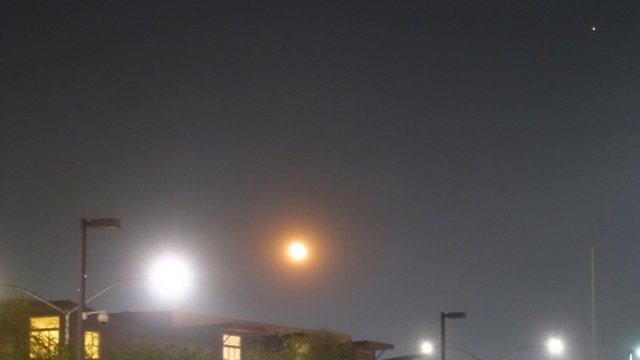 orange full moon, saturday night, smoky sky