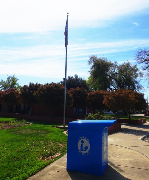 tracy public library, flag, book drop