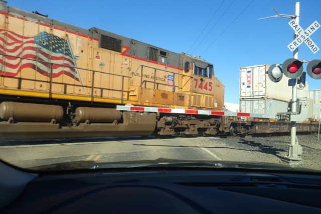 Train Crossing, long train, two lane road, train engine
